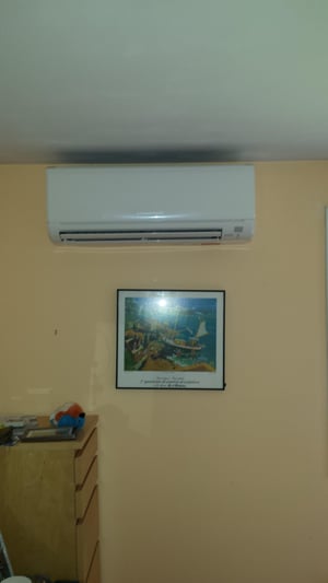 Mitsubishi ductless heating and cooling system installation in a Concord, MA ranch home