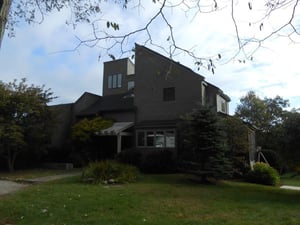 Contemporary home in Gloucester, MA, upgrades from window ACs to a ductless system. 