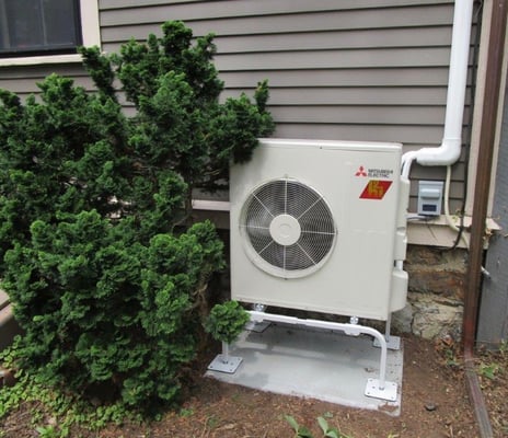 Outdoor install of Mitsubishi Hyper-Heating heat pump in Cambridge, MA.