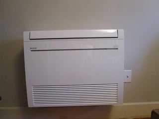 Wall mounted unit for a Somerville attic makes perfect use of space.