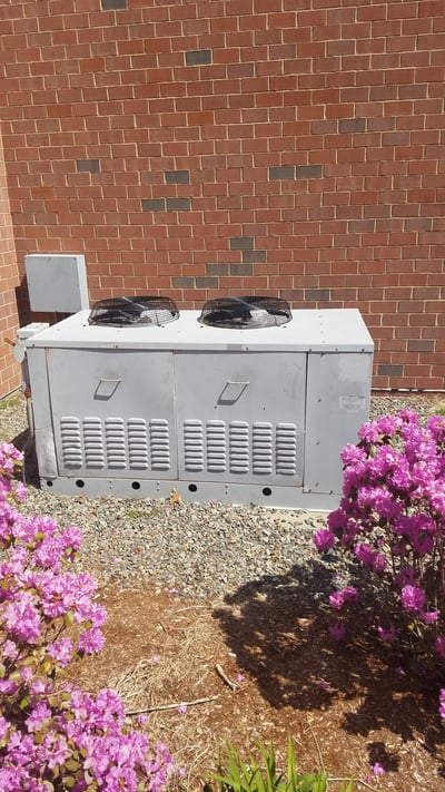 Westwood High School gets an outdoor condenser unit upgraded for cafeteria walk-in cooler system. 